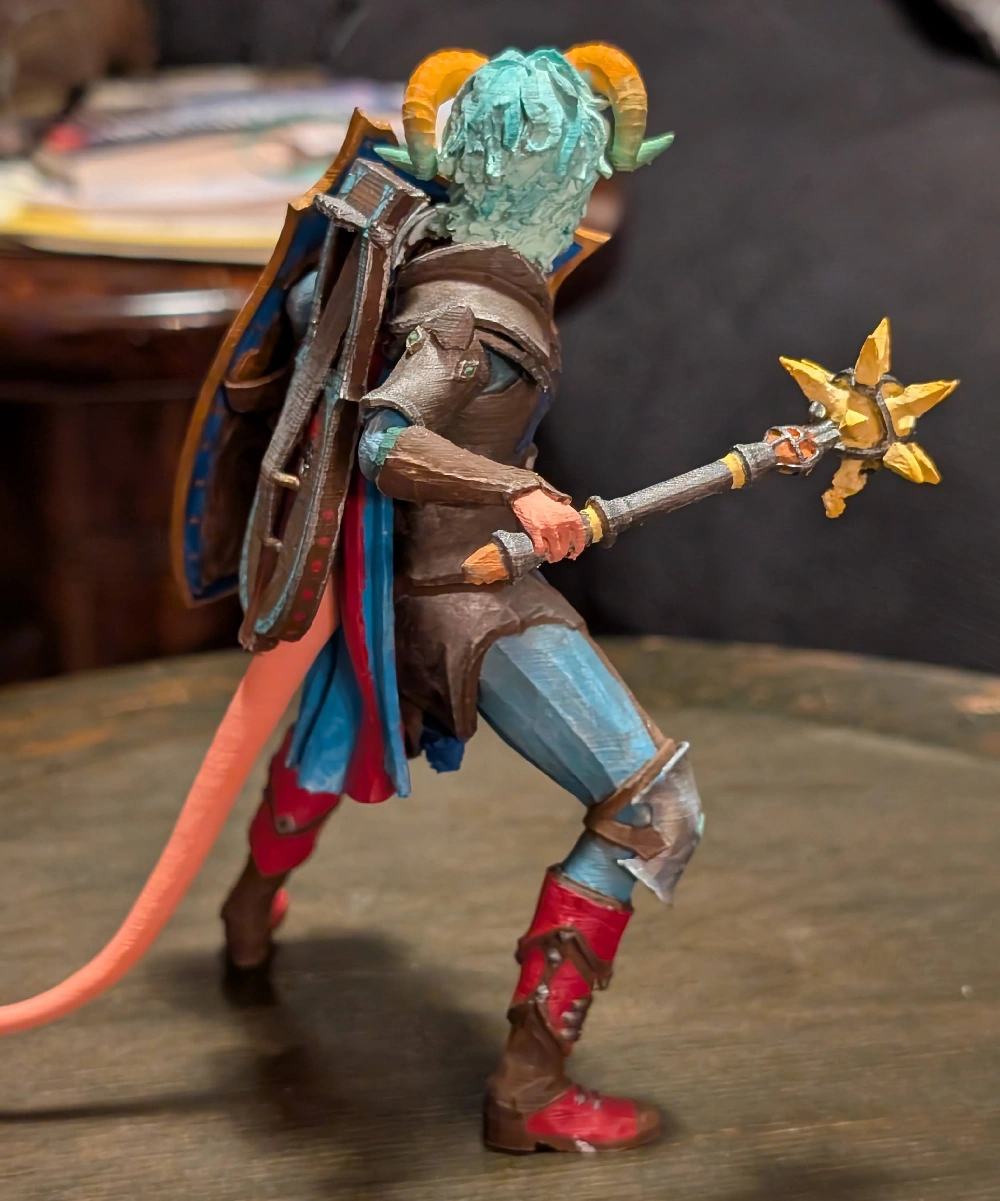 The finished, painted 3D printed Tiefling character from the backside.
