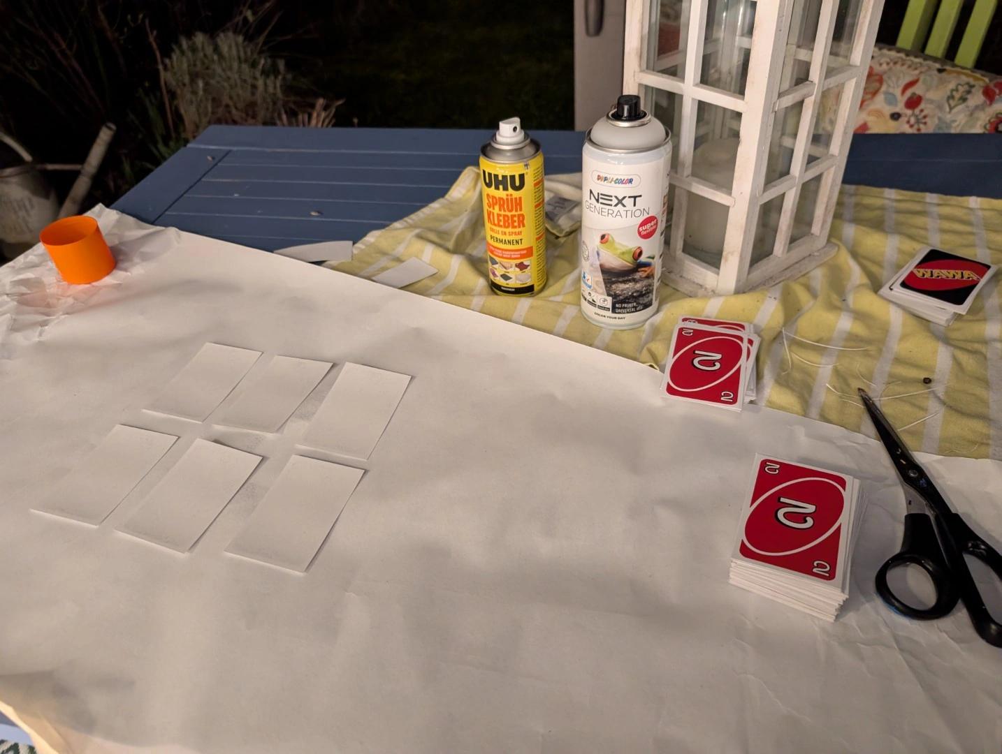 Gluing the front and backsides of the cut cards together.